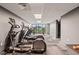 Bright gym featuring treadmills, elliptical machines, and large windows offering outside views at 214 Hunt St # 701, Durham, NC 27701