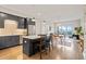 Modern kitchen with stainless steel appliances, island with breakfast bar, and open floor plan at 214 Hunt St # 701, Durham, NC 27701