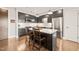 Gourmet kitchen features sleek cabinetry, stainless steel appliances, and an island with breakfast bar at 214 Hunt St # 701, Durham, NC 27701