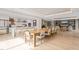 Open-concept living space with a dining table, kitchen island, and contemporary design at 214 Hunt St # 701, Durham, NC 27701