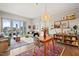 Bright open-concept living room with hardwood floors and a beautiful city view from a private balcony at 214 Hunt St # 701, Durham, NC 27701