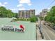 Sign for Durham Central Park with a multi-story apartment building in the background at 214 Hunt St # 701, Durham, NC 27701
