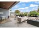 Outdoor patio with a grill, modern furniture, and a view of the surrounding neighborhood at 214 Hunt St # 701, Durham, NC 27701