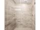 Tiled shower with glass doors and overhead showerhead at 214 Hunt St # 701, Durham, NC 27701
