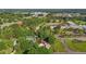 Aerial view of home with mature trees, a swimming pool, and well-kept grounds at 2257 Delaney Dr, Burlington, NC 27215