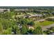Aerial view of property with mature trees and landscaping near a school at 2257 Delaney Dr, Burlington, NC 27215