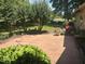 Spacious backyard featuring a large patio and plenty of shade from mature trees at 2257 Delaney Dr, Burlington, NC 27215