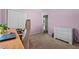 Cozy bedroom with neutral carpet and a view of the hallway with a walk-in closet at 2257 Delaney Dr, Burlington, NC 27215