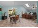Dining area with a vintage table, chandelier and access to the living room through a large, open doorway at 2257 Delaney Dr, Burlington, NC 27215