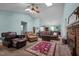 Large living room featuring carpet, high ceilings with skylights, and a brick fireplace at 2257 Delaney Dr, Burlington, NC 27215