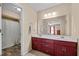 Bathroom with a double sink vanity with carpet flooring and shower at 2257 Delaney Dr, Burlington, NC 27215