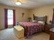 Comfortable bedroom boasts a comfortable bed, warm carpet, and natural light from one window at 2257 Delaney Dr, Burlington, NC 27215
