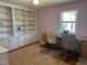 Office space features custom built-ins, neutral carpet, and dual desks for working at home at 2257 Delaney Dr, Burlington, NC 27215