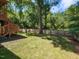 The backyard features a wooden deck, green grass and a hammock at 23 Joci Ct, Durham, NC 27704