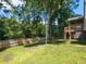 Large backyard featuring green grass, a wooden deck and a hammock at 23 Joci Ct, Durham, NC 27704