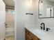 Modern bathroom with marble countertops, updated fixtures, and a shower/tub combination at 23 Joci Ct, Durham, NC 27704