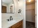 Bathroom with new light fixtures, a new mirror, and a walk-in closet at 23 Joci Ct, Durham, NC 27704