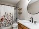 Updated bathroom with a stylish mirror, modern sink, and a tub shower at 23 Joci Ct, Durham, NC 27704