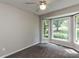 Bedroom featuring plush carpet and a large bay window with natural light at 23 Joci Ct, Durham, NC 27704