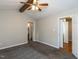 Spacious bedroom featuring carpeted floors and access to the ensuite at 23 Joci Ct, Durham, NC 27704