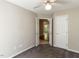 Bedroom featuring plush carpet with neutral colored walls and a closet at 23 Joci Ct, Durham, NC 27704