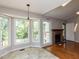 Bright breakfast nook with large windows, views, and tile flooring at 23 Joci Ct, Durham, NC 27704