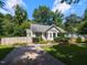 Well-maintained home with driveway, lawn and mature trees at 23 Joci Ct, Durham, NC 27704