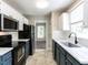 Modern kitchen with stainless steel appliances and white countertops at 23 Joci Ct, Durham, NC 27704