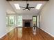 Spacious living area with fireplace, hardwood floors, and lots of natural light at 23 Joci Ct, Durham, NC 27704