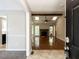 Open living room featuring hardwood floors, vaulted ceiling, and brick fireplace at 23 Joci Ct, Durham, NC 27704