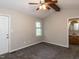Main bedroom with carpet, ceiling fan, and ensuite bathroom at 23 Joci Ct, Durham, NC 27704