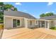 Expansive wooden deck, great for entertaining, with lush green landscaping at 232 S Marshall St, Graham, NC 27253