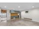 Clean basement area with built-in storage and access to a garage at 232 S Marshall St, Graham, NC 27253