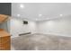 Spacious unfinished basement with white walls and concrete flooring at 232 S Marshall St, Graham, NC 27253