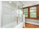 Shower features glass enclosure and a decorative mosaic design at 232 S Marshall St, Graham, NC 27253