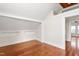 Bedroom featuring wood floors and access to other living spaces at 232 S Marshall St, Graham, NC 27253
