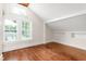 Bright bedroom with wood floors, ample natural light, and built-in shelves at 232 S Marshall St, Graham, NC 27253