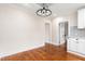 Open dining room with hardwood floors, updated lighting, and natural light at 232 S Marshall St, Graham, NC 27253