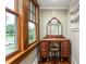Dressing area with vanity, mirror, and natural light from large windows at 232 S Marshall St, Graham, NC 27253