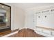 Charming entryway featuring hardwood floors, and a convenient storage nook at 232 S Marshall St, Graham, NC 27253