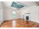 The living room offers hardwood floors, a fireplace, and plenty of natural light at 232 S Marshall St, Graham, NC 27253
