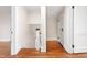 Inviting staircase with hardwood floors and white trim leads to upper level at 232 S Marshall St, Graham, NC 27253