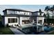 Inviting backyard with a pool, covered patio, outdoor kitchen, and lounge area perfect for entertaining at 2344 Ballywater Lea Way, Wake Forest, NC 27587