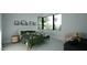 Bright bedroom with a corner window, comfortable bed, and minimalist decor offering a serene retreat at 2344 Ballywater Lea Way, Wake Forest, NC 27587