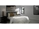 Cozy bedroom featuring a plush bed, stylish decor, and natural light from the large windows at 2344 Ballywater Lea Way, Wake Forest, NC 27587