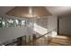 Bright foyer featuring wood beam ceiling, stone wall, and modern chandelier lighting the entry at 2344 Ballywater Lea Way, Wake Forest, NC 27587