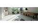 Spacious game room with a shuffleboard table, wet bar, and comfortable seating offering a fun entertainment space at 2344 Ballywater Lea Way, Wake Forest, NC 27587