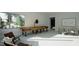 Inviting game room featuring a wooden shuffleboard table, comfortable seating, and bright natural light at 2344 Ballywater Lea Way, Wake Forest, NC 27587