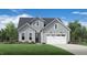 Charming two-story home showcasing a well-manicured lawn and a welcoming two-car garage at 2404 Flemingstone Ln # 51, Raleigh, NC 27610