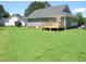 Backyard of home with wooden deck at 2662 Walas Ct, Creedmoor, NC 27522
